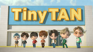 Seven chibi anime characters standing in front of a building with a 'Tiny TAN' sign. — Tiny Tan Bts Wallpaper
