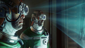 Two astronauts in futuristic gear look at a bright blue light through a window. — Prey Wallpaper