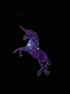 A glowing galaxy unicorn leaping against a black background. — Unicorns Wallpaper