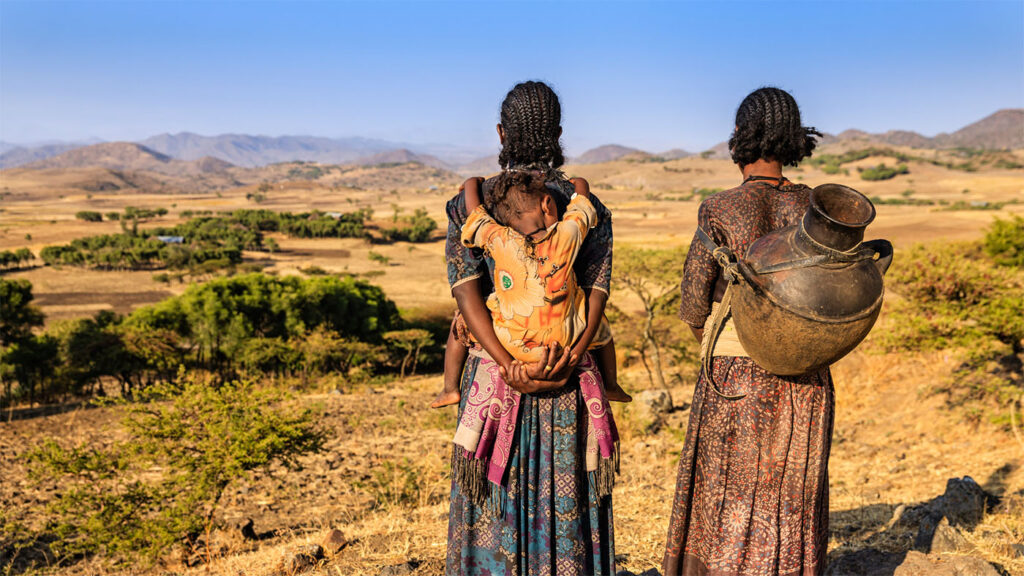 Image of two women in Ethiopia looking out across the horizon